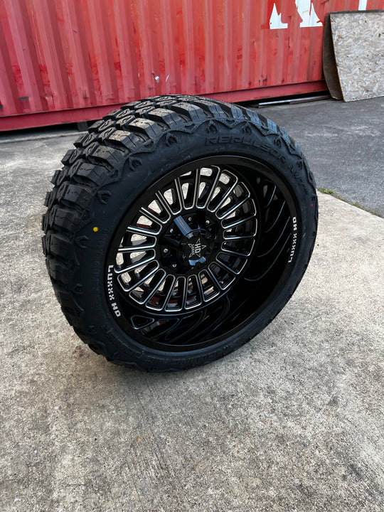 22x12 6x5.5 & 6x135 Luxx Hd LHD27 Gloss Black Milled wheels and 33x12.50 RBP MT RX tires - 1 wheel has minor damage